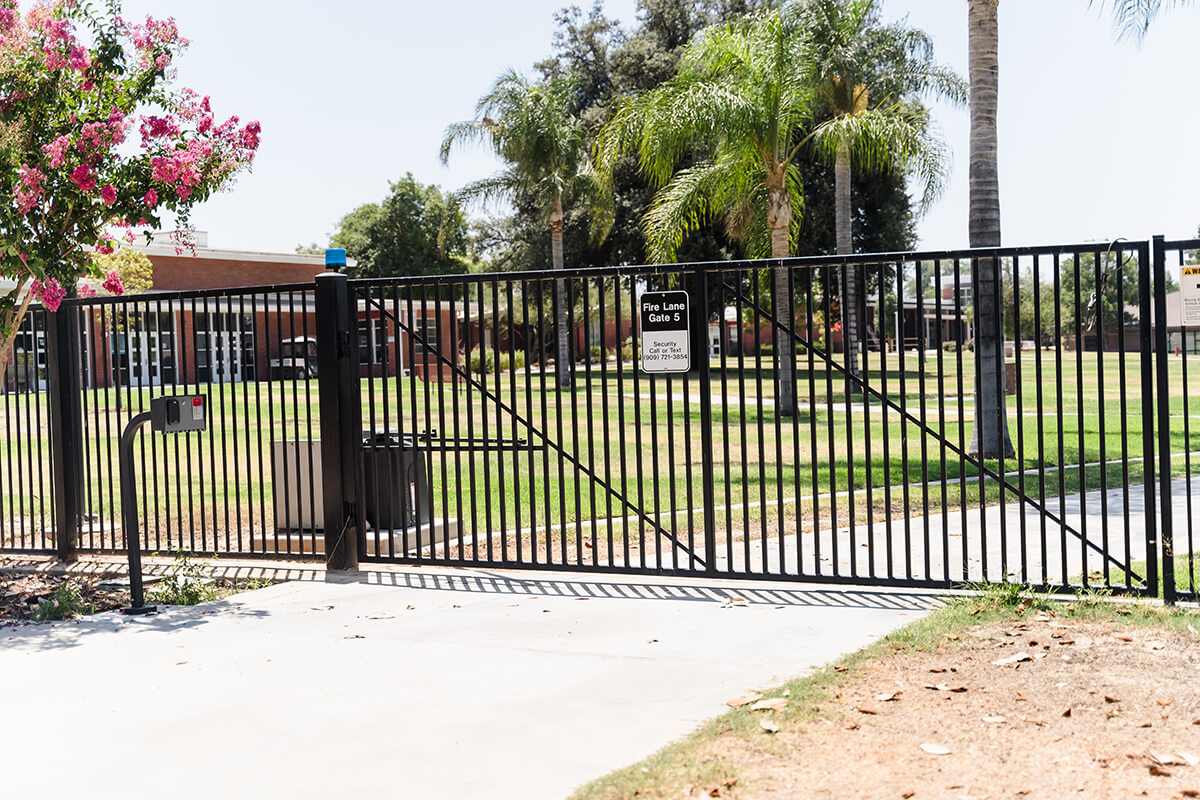 CA School Riverside 2 swinging wrought iron automatic gate