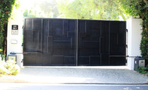 black layered steel electric bifold gate