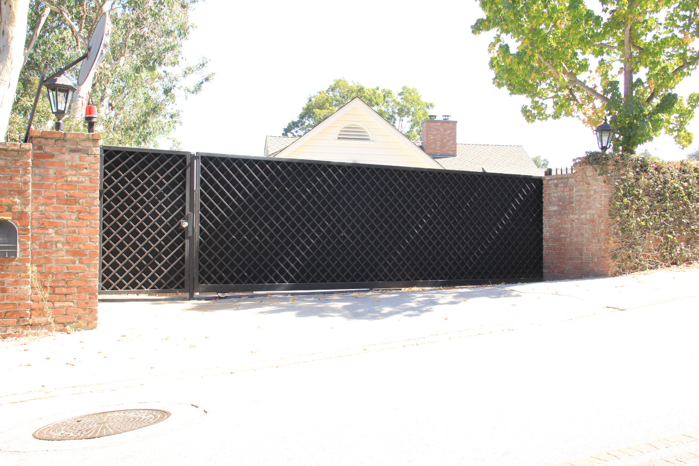 custom built steel lattice sliding electric gate and pedestrian gate Los Angeles
